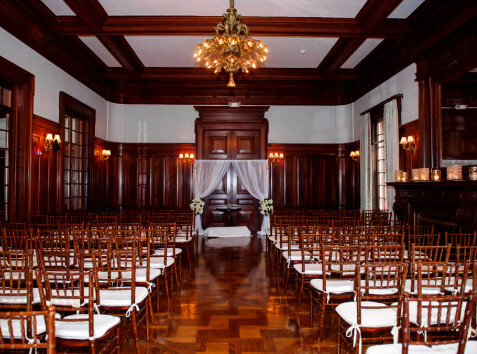 Indoor wedding ceremony setting at Bourne Mansion in Oakdale, New York